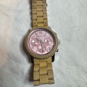 Michael Kors Parker Chronograph with a pink dial/ beige (blush acetate) band.